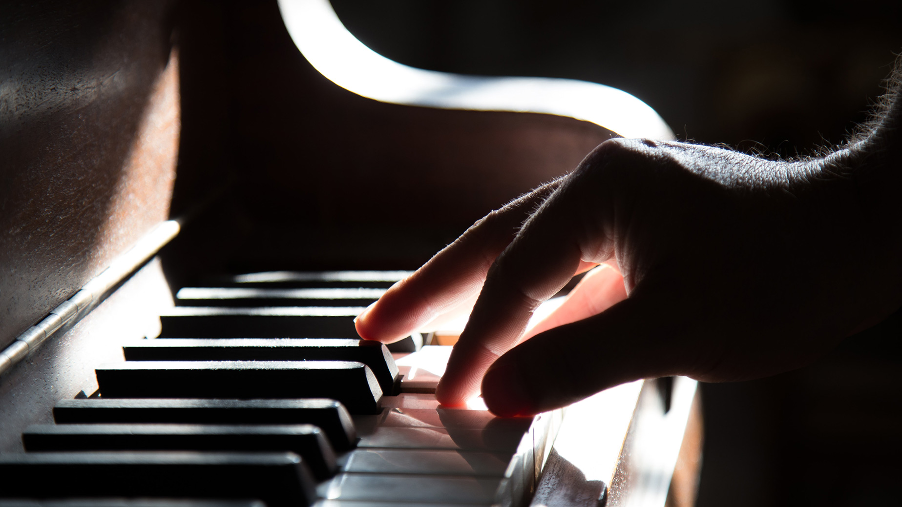 Male hand on piano keys